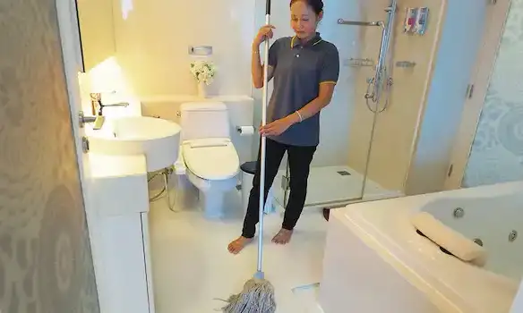 The woman is cleaning up